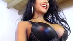 Busty curly brunette with big boobs fucks on couch