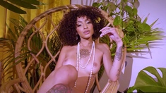 Petite ebony beauty exposes pierced tits