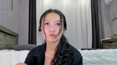 Asian babe sucking and jerking two hard dicks