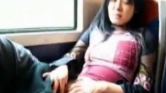 Asian milf masturbates pussy in the train