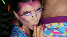 Brunette female with ponytails and colorful make-up